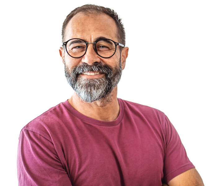 Man with glasses smiling.
